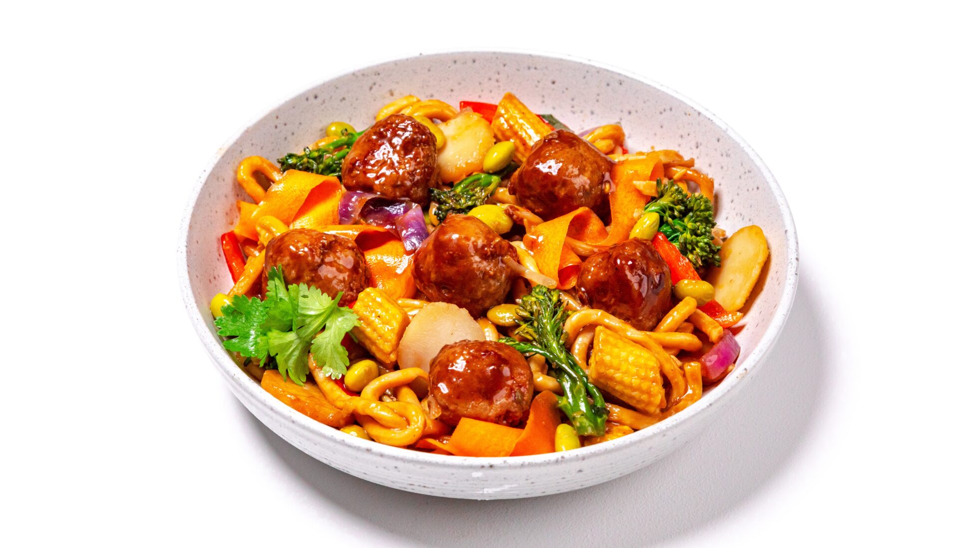 Hoisin meatballs with noodles in a white bowl