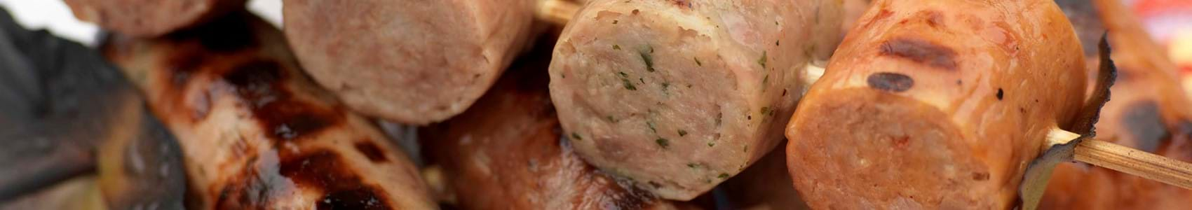 Up close shot of sausages on a skewer