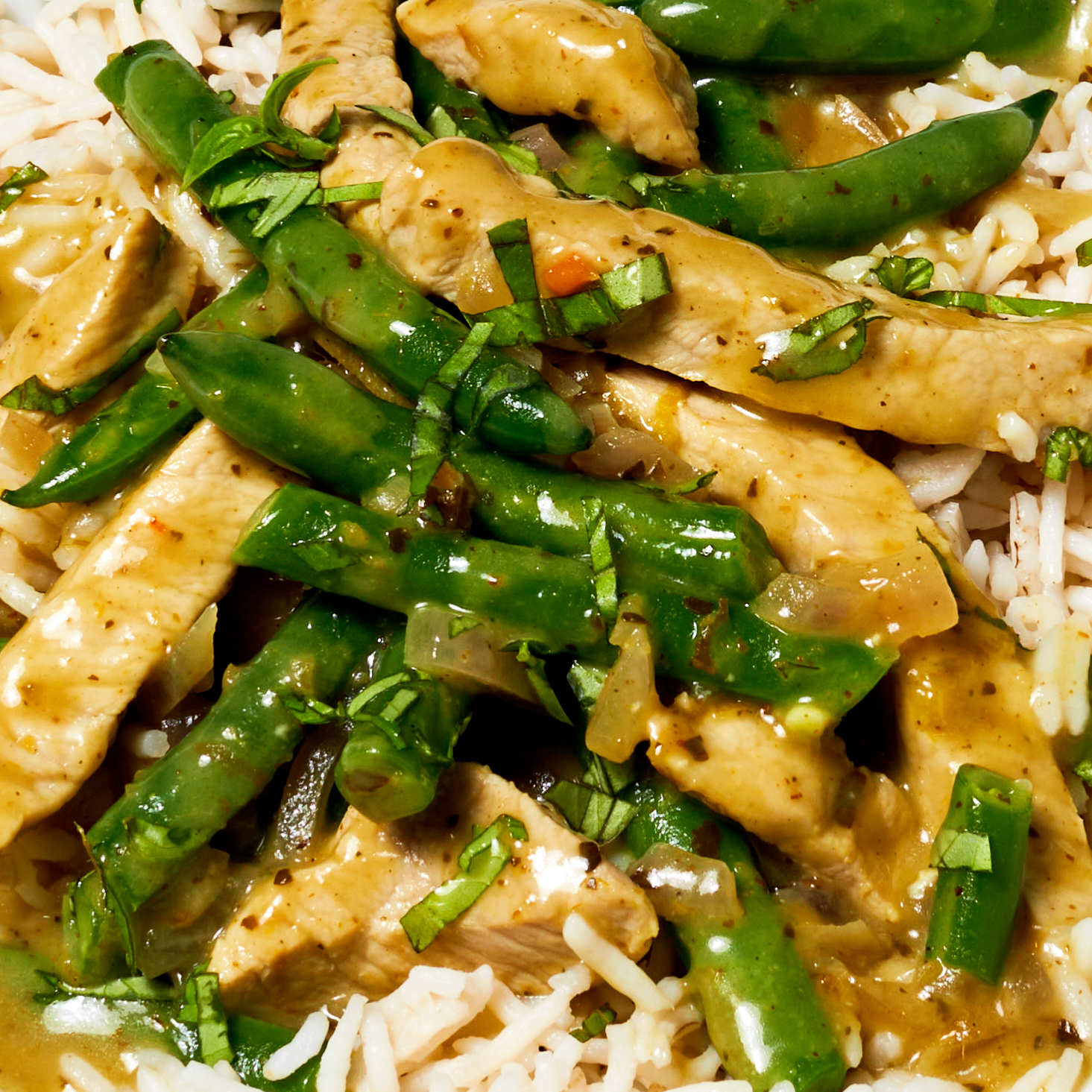 Up close shot of thai green pork curry with green beans