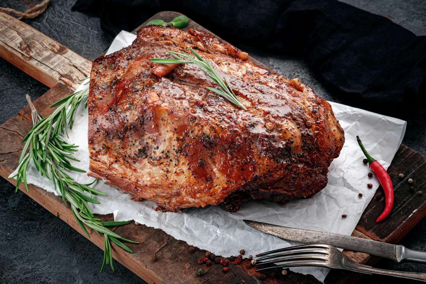 Roast pork resting on a board