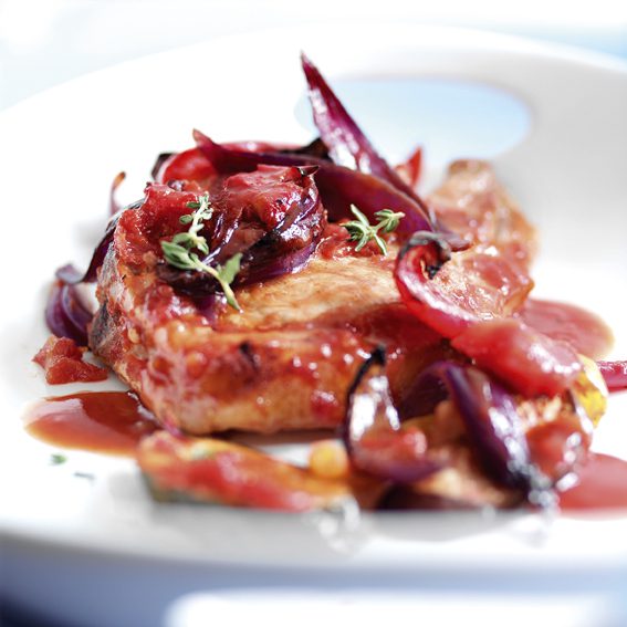 Baked pork ratatouille on a white plate