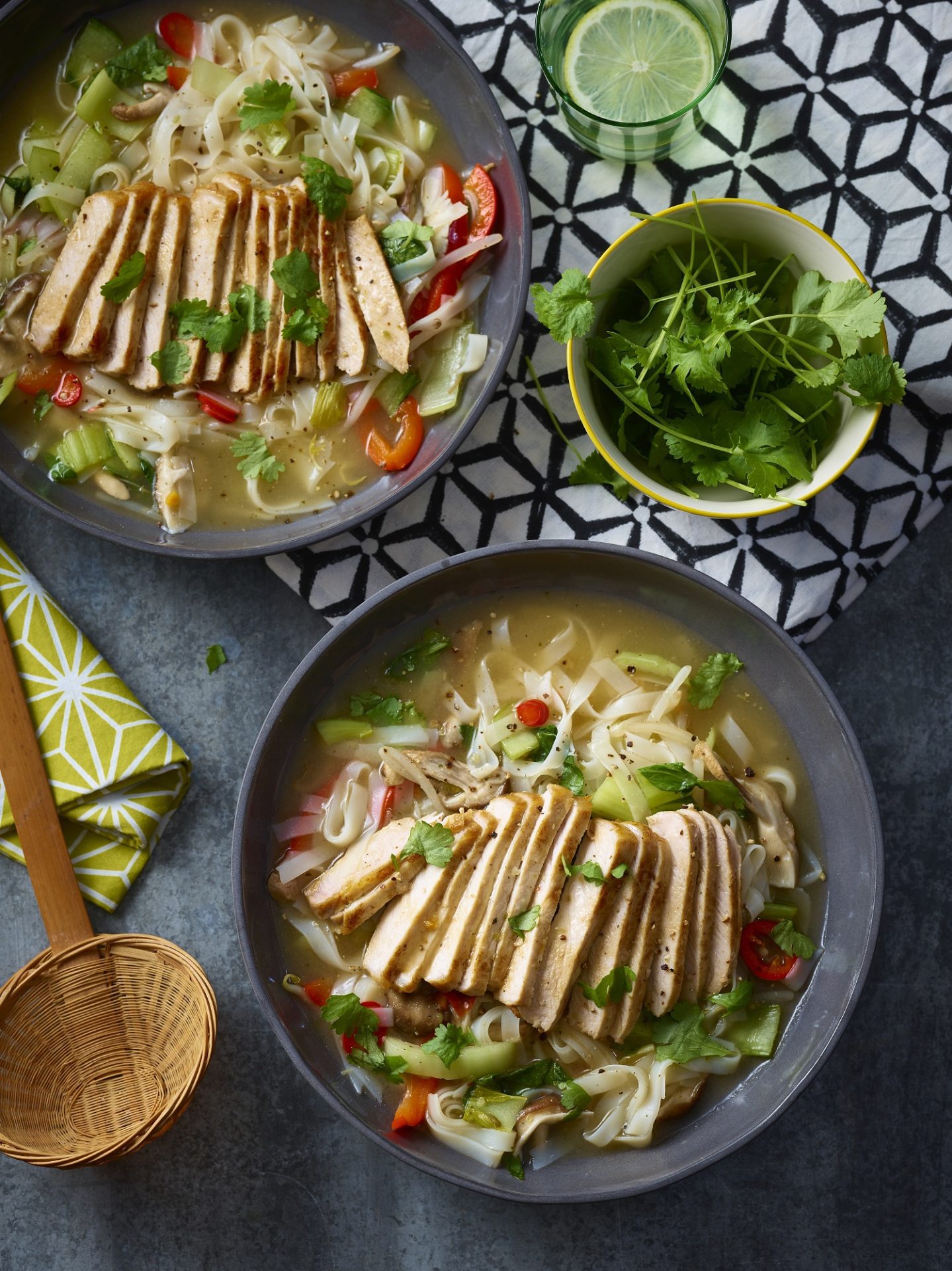 Sliced pork medallions ramen in a grey bowl