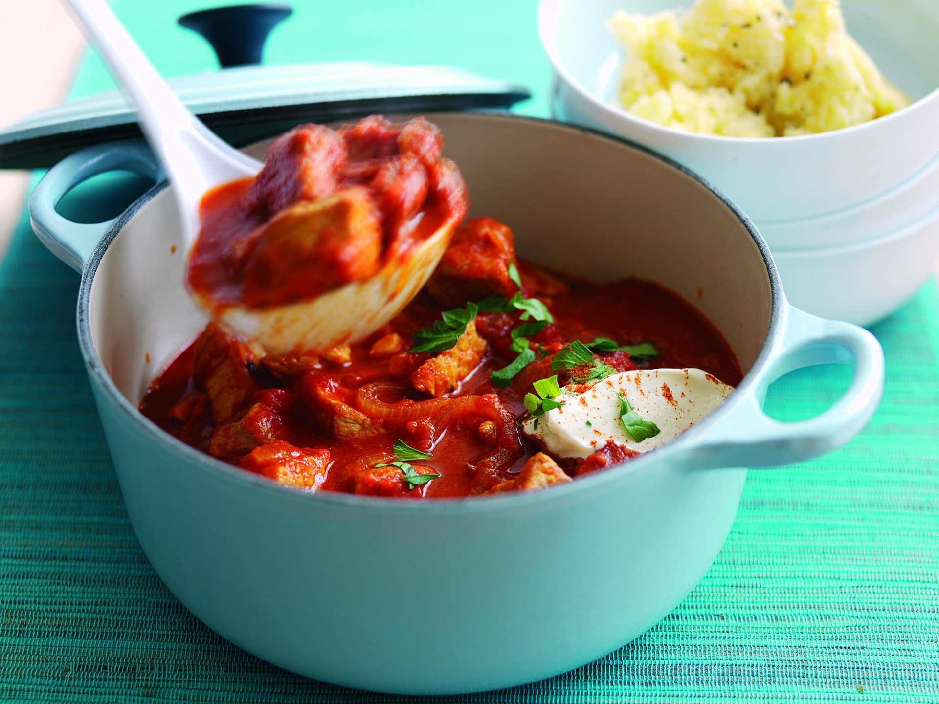 Chunks of pork, sausage and chorizo in a creamy paprika sauce