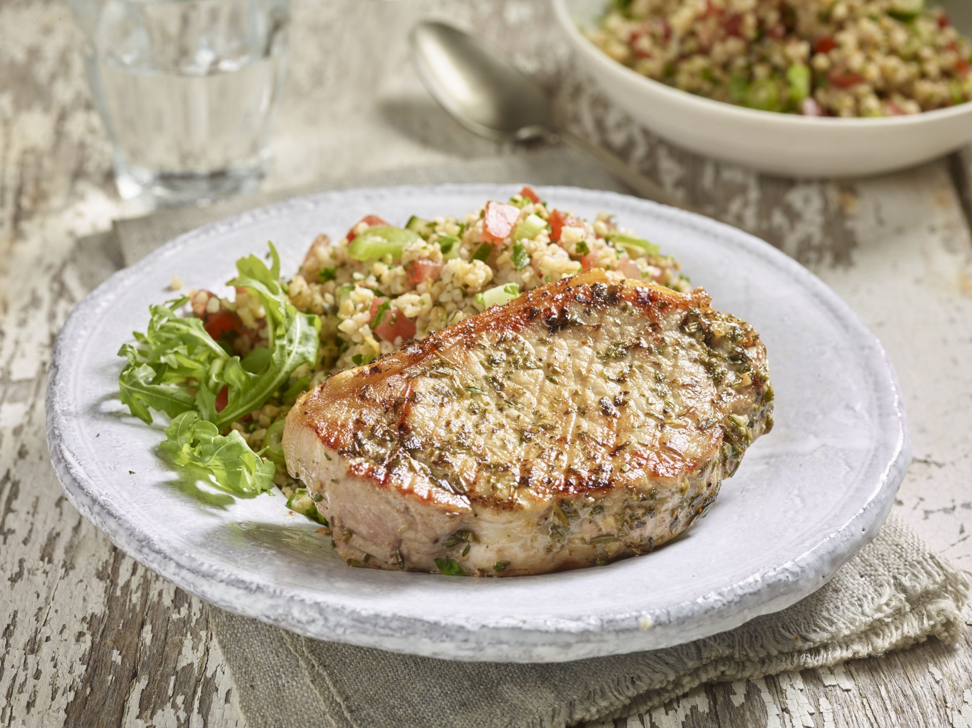 Chermoula pork medallion served on a white plate