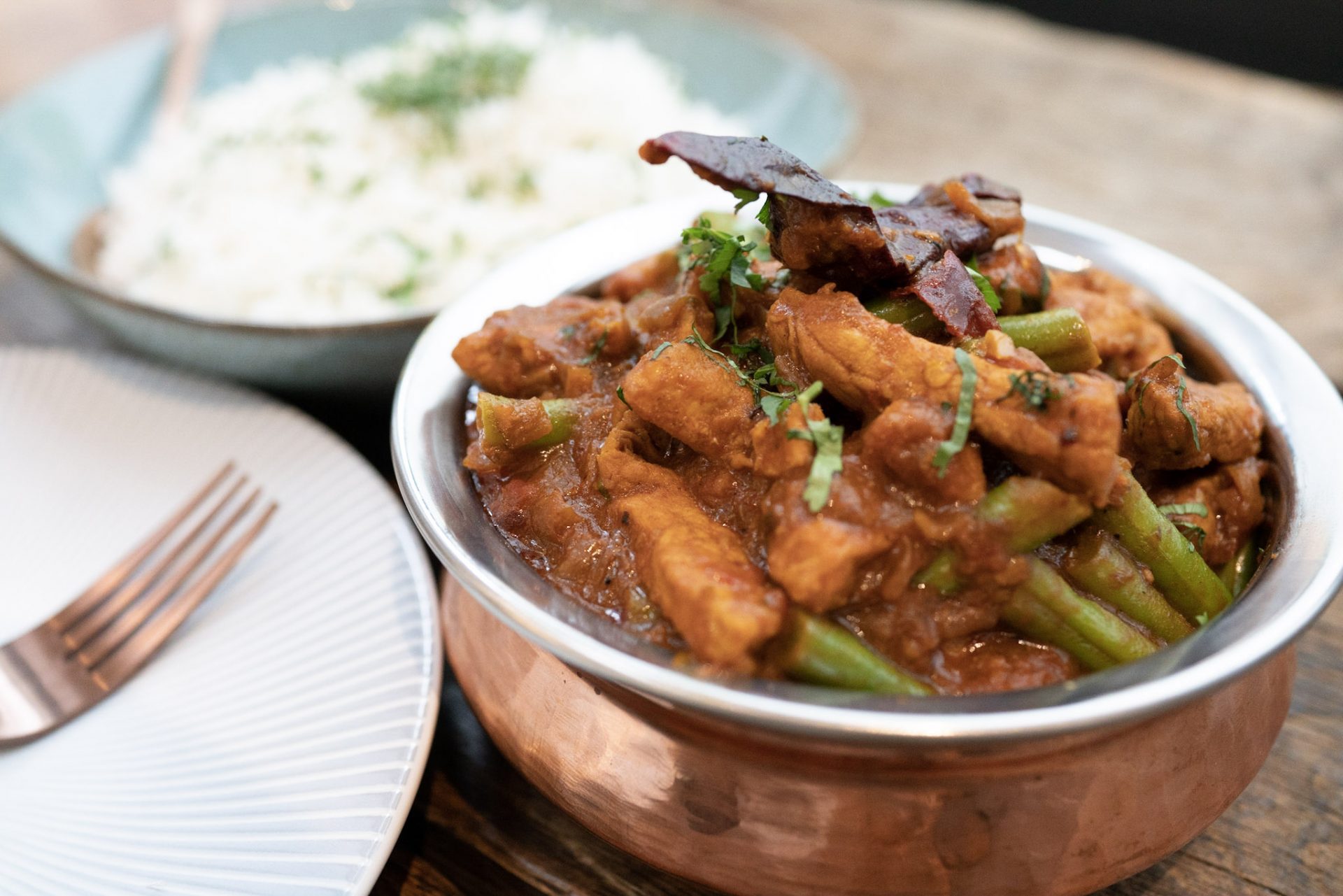 Metal bowl containing pork Keralan Pandi curry dish