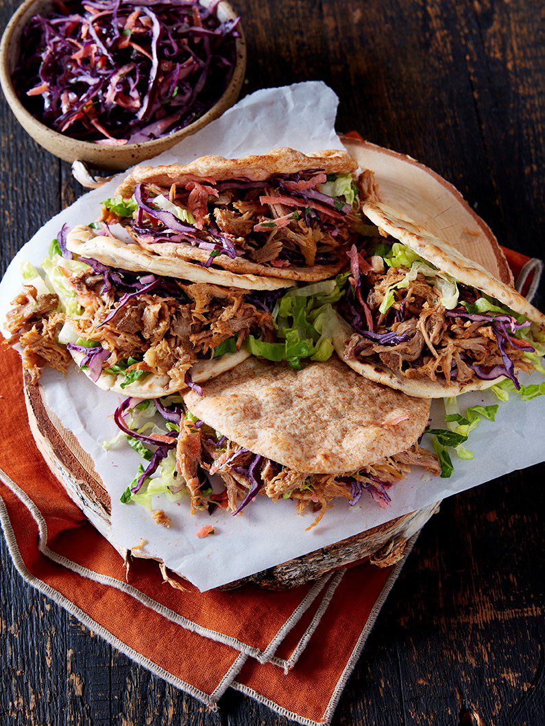 Four flatbreads filled with pulled pork and coleslaw