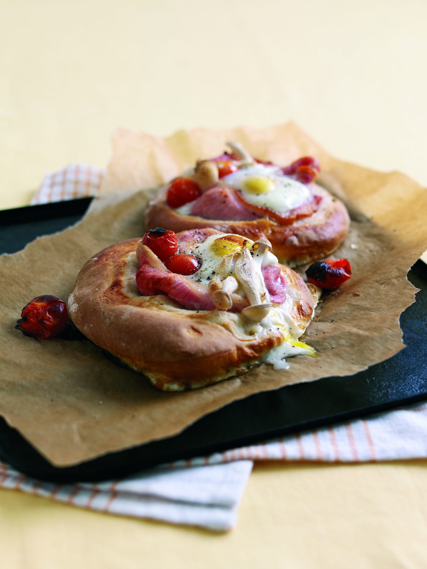 Smoked wiltshire cured bacon brunch bread served on a black board