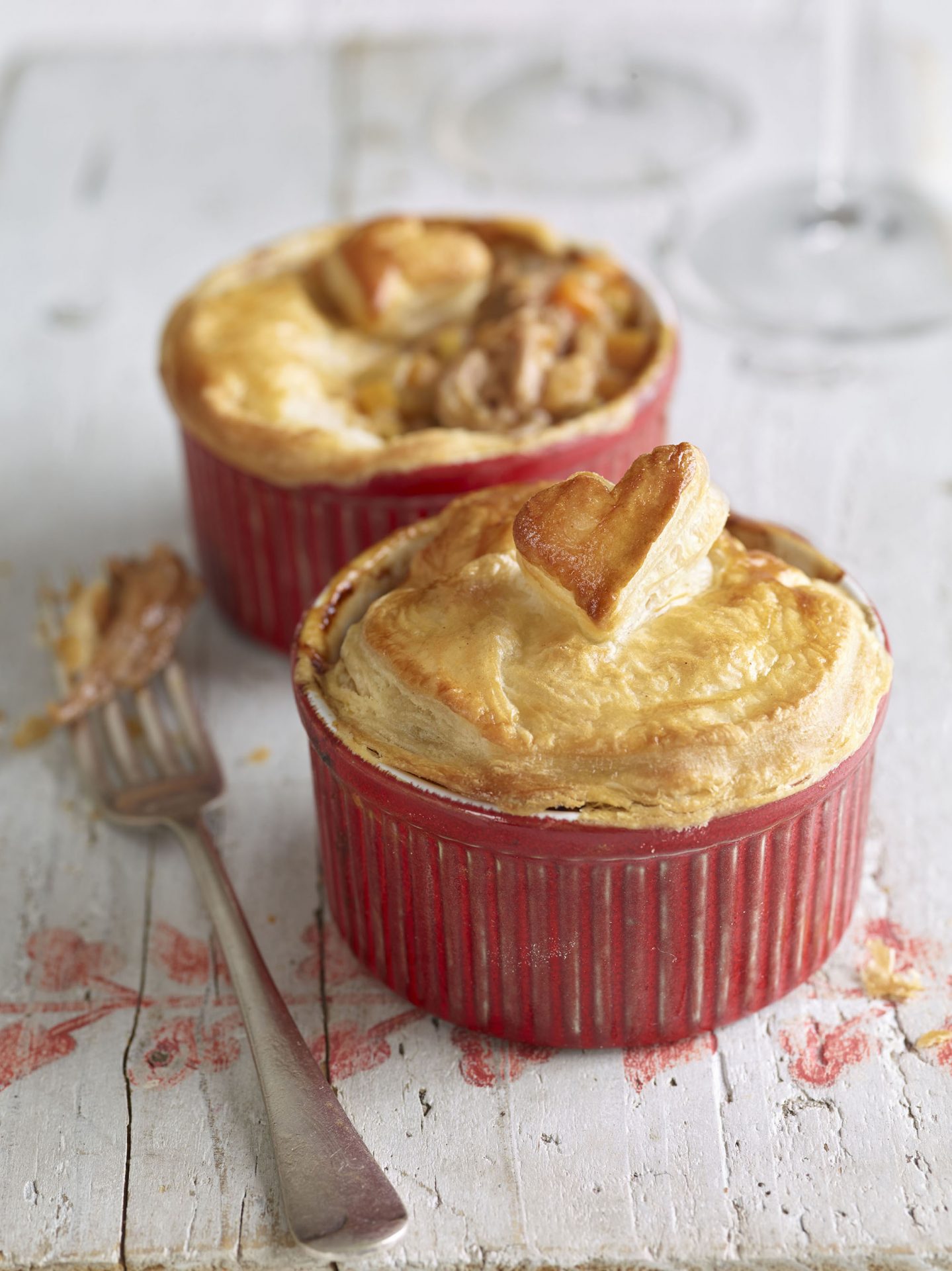 2 individual pulled pork pies with heart shaped pastry lids