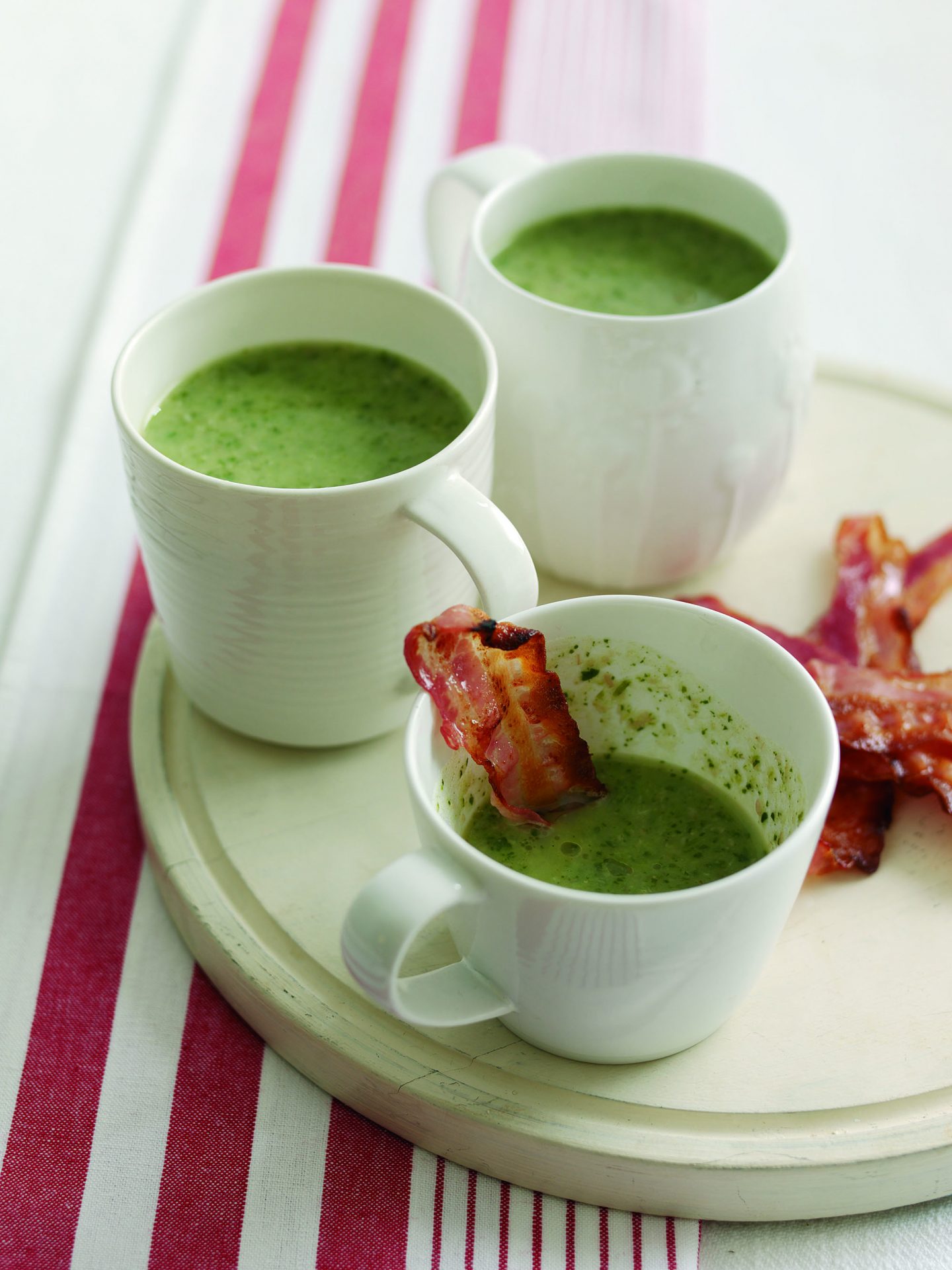 Watercress and bacon soup in little white mugs