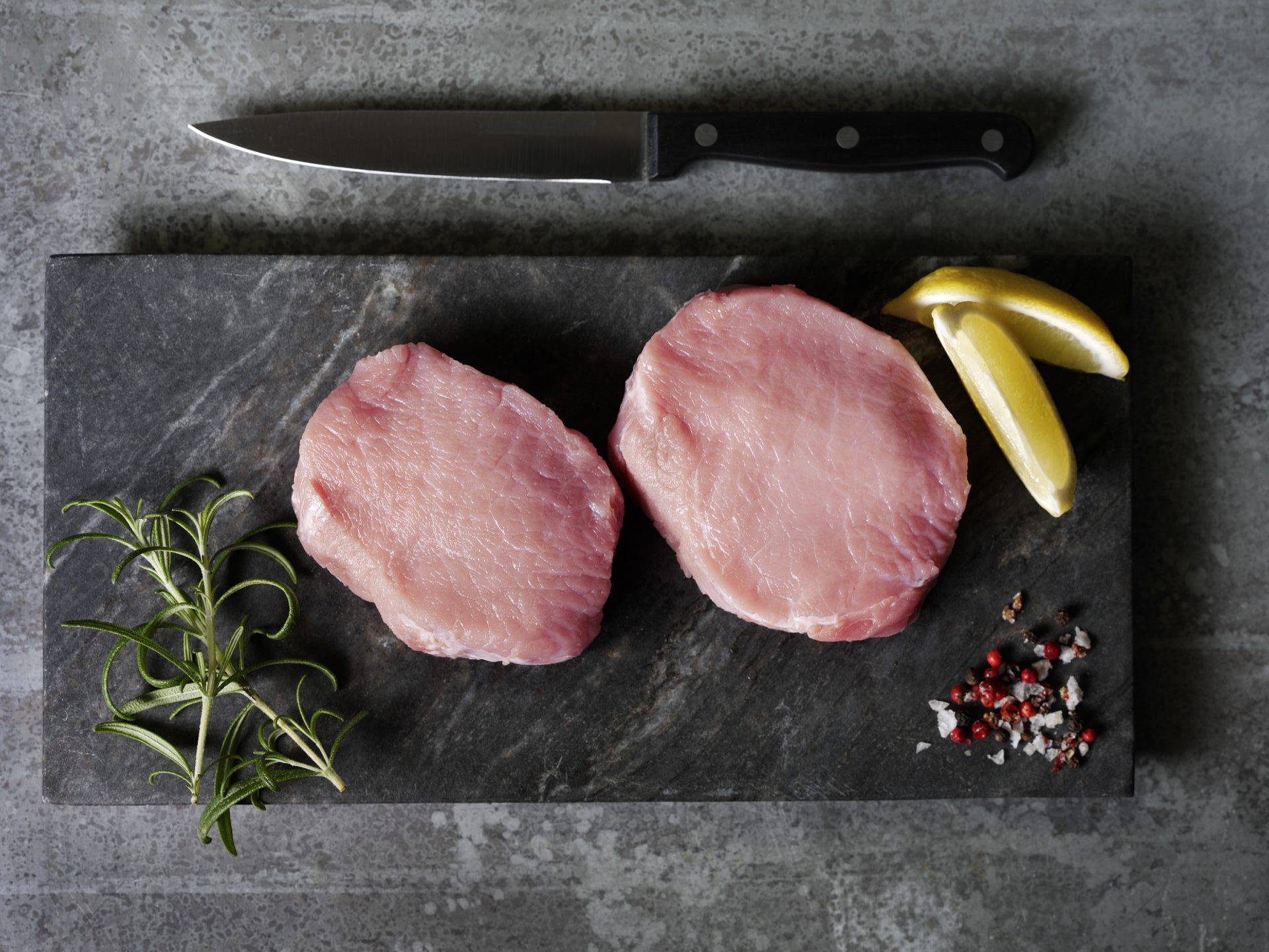 pork loin medallion on a black board