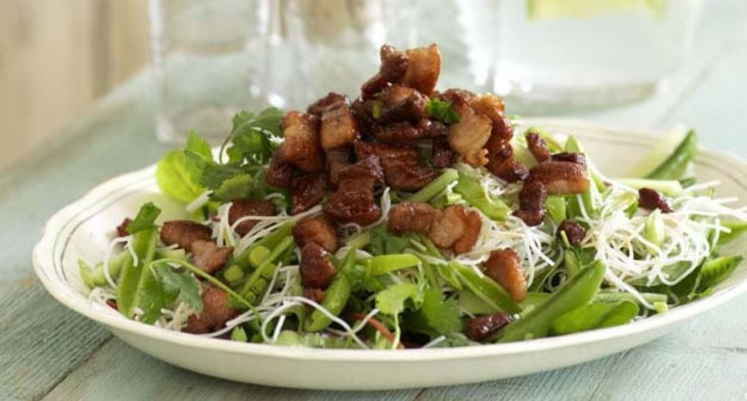 Crispy pork and noodle salad in a bowl