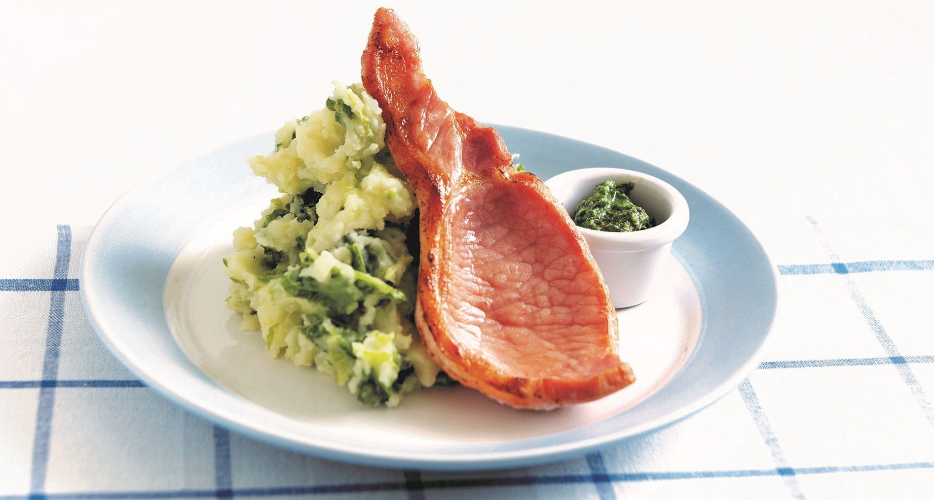 Bacon chops with colcannon parsley and basil pesto