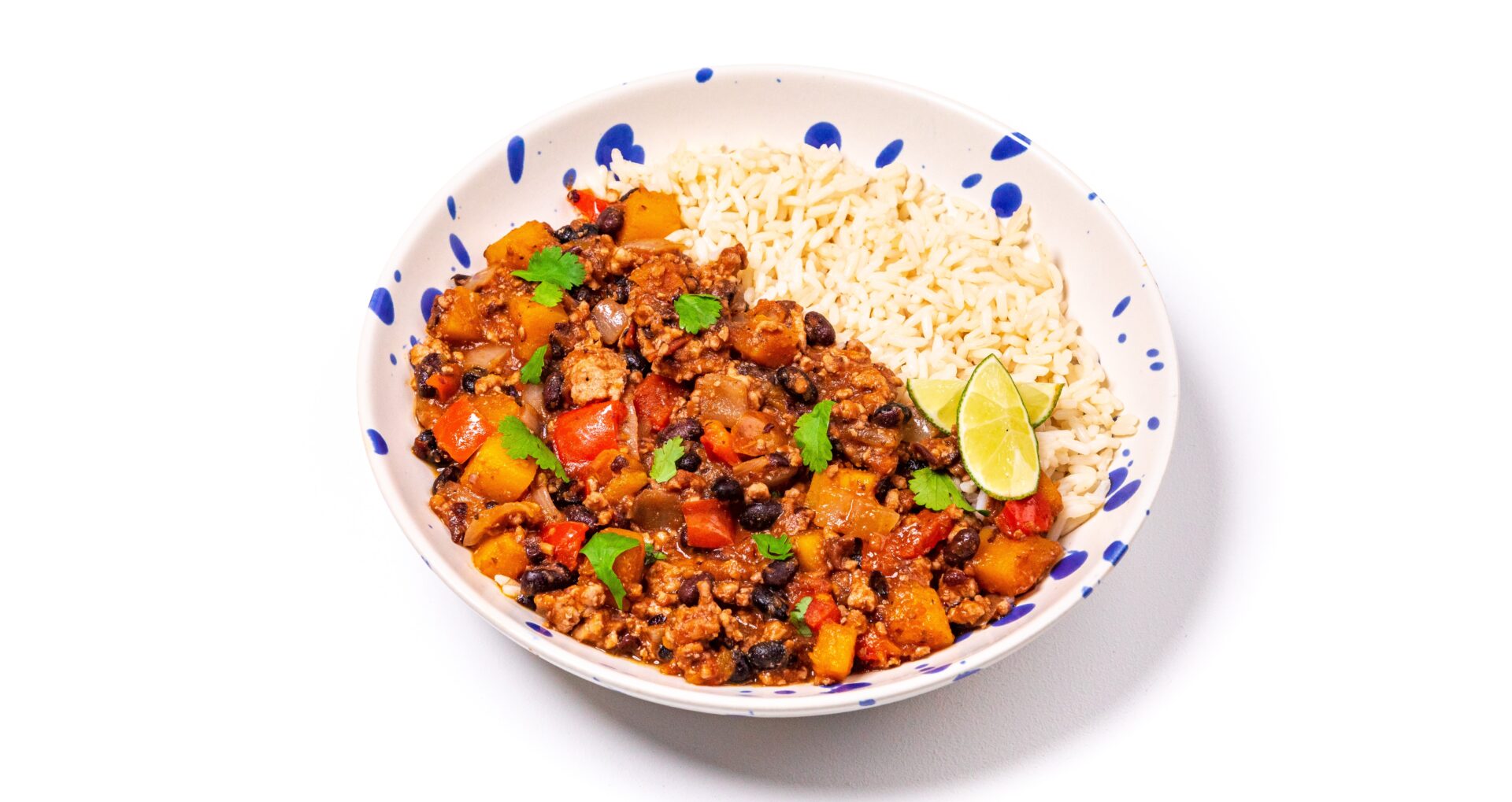 Chilli con carne with rice in a spotty blue and white bowl