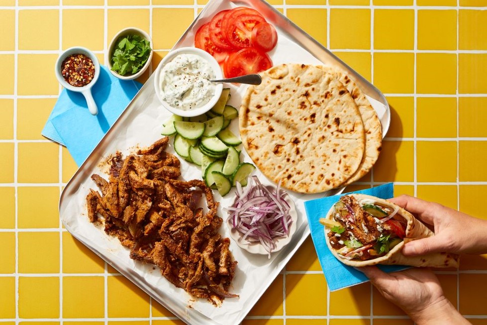 Pork shoulder steak gyros served on a tray to be assembled