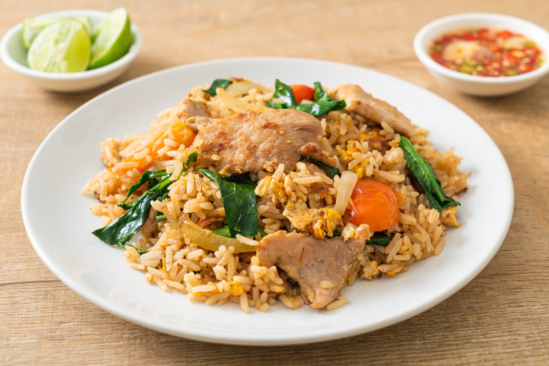 Chinese pork fried rice on a white plate