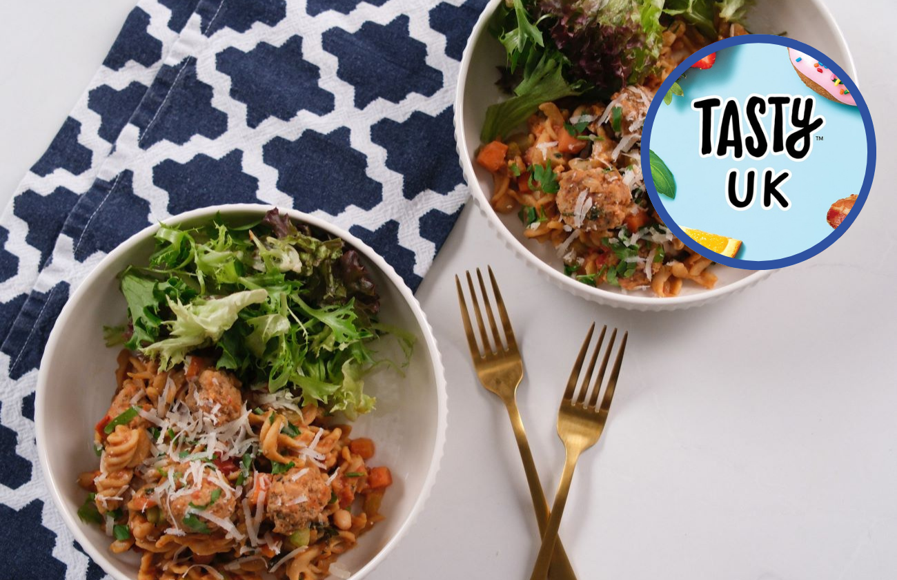 Pork Meatball and Bean Pasta served in two bowls with side salad.